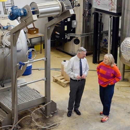 Kate in a dyehouse in Derbyshire speaking to a manufacturer